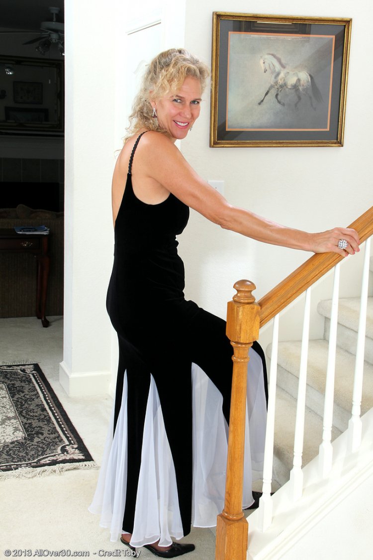 54 year old Sabrina from AllOver30 slides out of her elegant dress