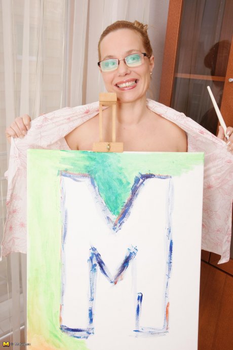 Naughty mature lady playing with paint